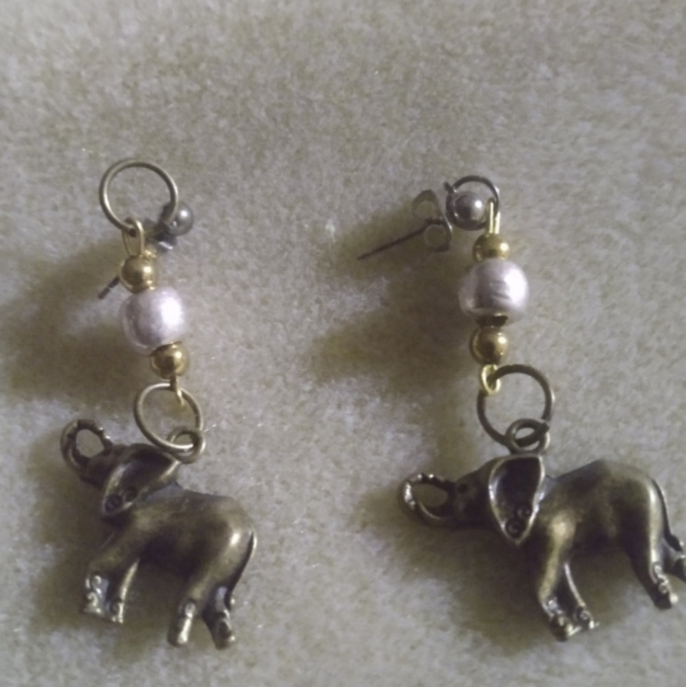 Bronze elephants earrings on a from sh hook ear wire with  small  white pearl at